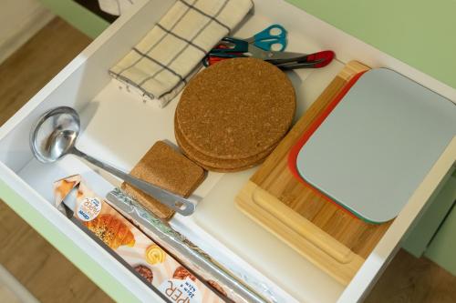 a drawer filled with food and a cutting board at Central 2BR - Workspace with Elevator in Varna City