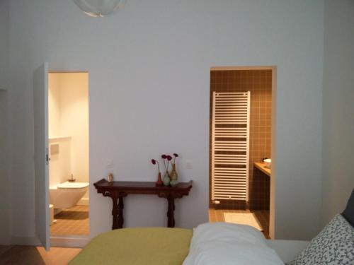 Postel nebo postele na pokoji v ubytování b&b les invités