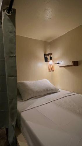 a bedroom with a bed in a room at Ginhawa Stay Mixed dorm 6 Bed in Burgos