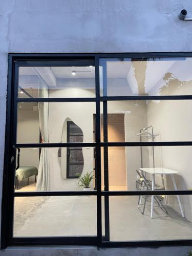 a view of a room through a window at Phieu Brew Homestay in Hà Tiên