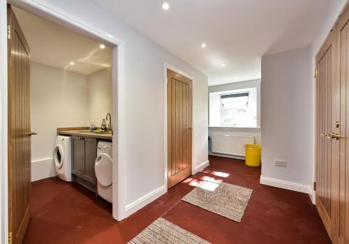 a bathroom with a toilet and a sink at The Studio at Pitmeadow Farm in Dunning