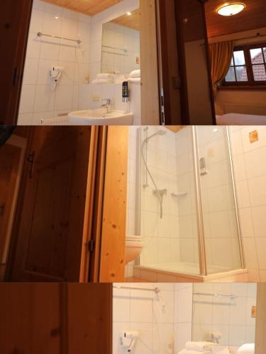 a bathroom with a sink and a shower at JOHN'S Pension in Saarwellingen