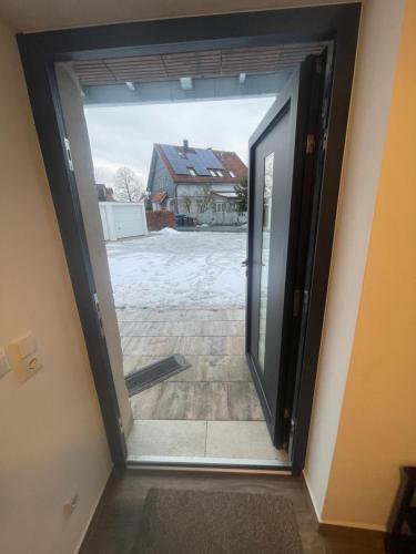 an open door to a house with a driveway at OK-City in Bayreuth