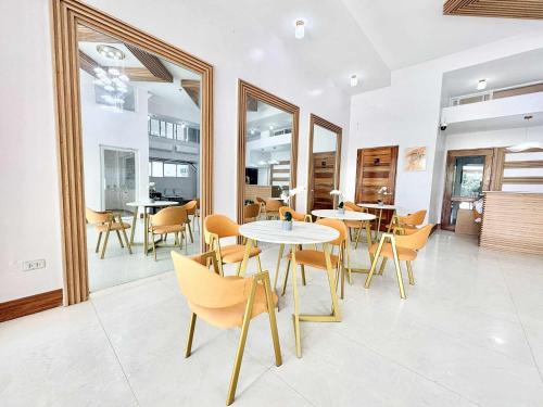 a dining room with a table and chairs at Palette Cebu The Almonds Boutique Aparthotel Near University of Cebu in Cebu City