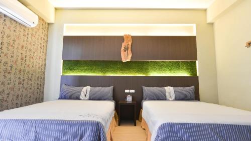 Postel nebo postele na pokoji v ubytování Minsuku B&B
