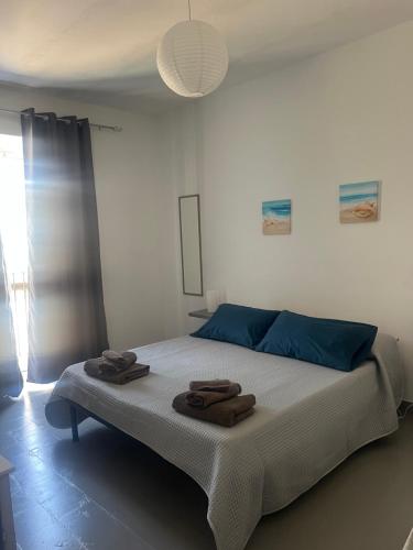 a bedroom with a bed with towels on it at Casa ISABELLA loc turist br in Lipari