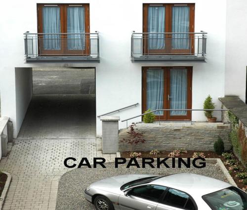 a car parked in front of a building at Baggot Court Townhouse in Dublin