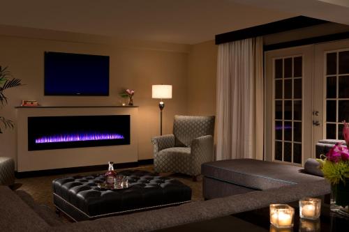 a living room with a couch and a fire place at Millennium Durham in Durham