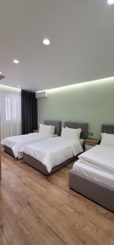 Postel nebo postele na pokoji v ubytování Suite Home