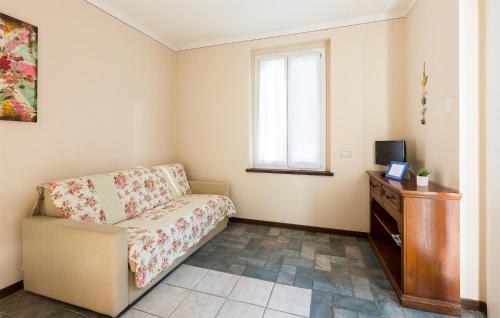 a living room with a chair and a television at Rio Molino 1 in Stresa