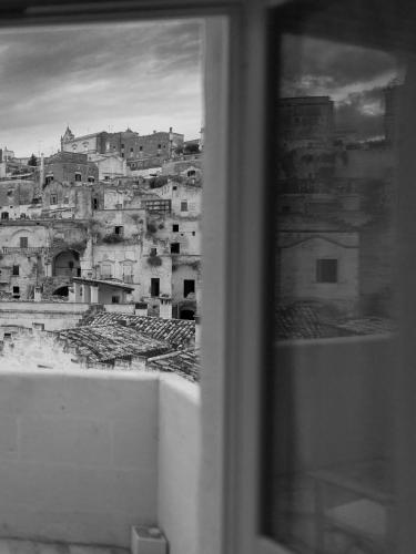 a view of a city from a window at Le Dimore Dell' Idris in Matera