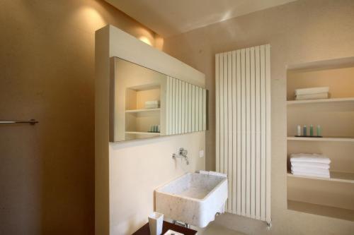 a bathroom with a sink and a mirror at Villa Rosmarino in Camogli