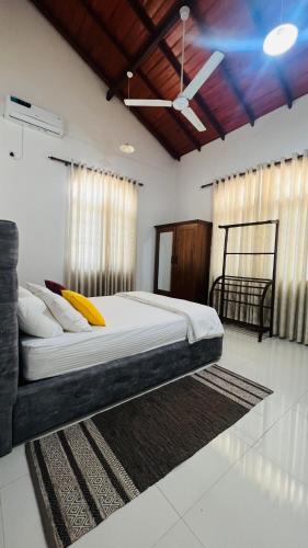 a bedroom with a large bed in a room at Eco Villa Resort in Negombo