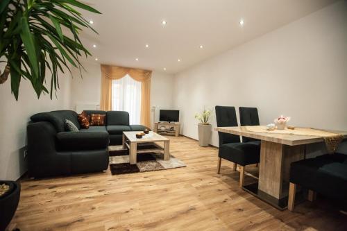 a living room with a couch and a table at Palatium Bad Ems in Bad Ems