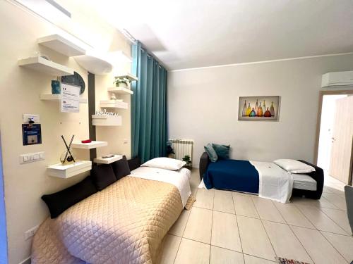 a bedroom with two beds and a window at ROMA ARCHAEOLOGICAL PARK Apartment in Ostia Antica