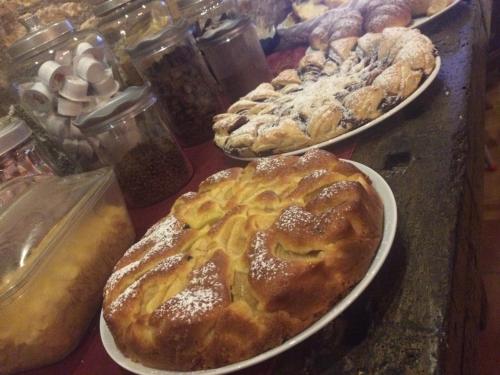 a table with three plates of pastries on at Casa Pellis in Fagagna