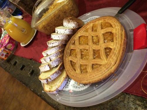 a plate of food with a waffle and bread at Casa Pellis in Fagagna