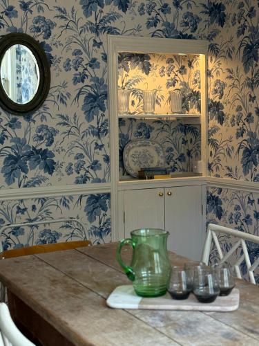 a dining room with blue and white wallpaper at NEW - Periwinkle Townhouse - 3-min walk from Bath Spa Station in Bath
