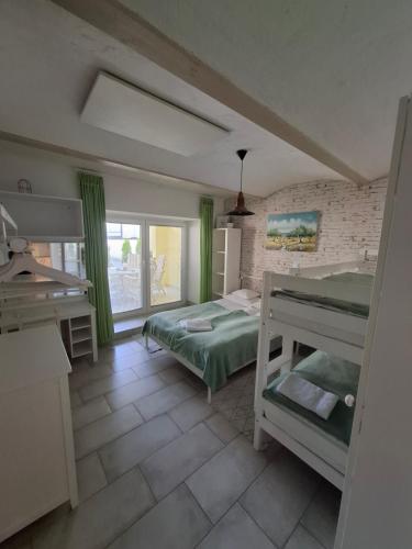 a bedroom with two bunk beds and a sink at Helena in Trzin