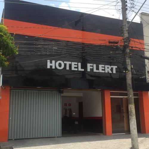 a hotel sign on the side of a building at Hotel Flert - Tatuapé in Sao Paulo