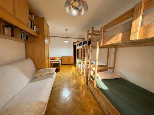 a room with two bunk beds and a desk at Golden Bay Apartment in Kotor