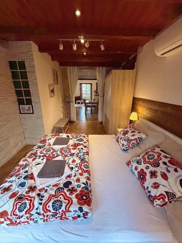 a bedroom with two beds with pillows on them at Erika's House. in Érd