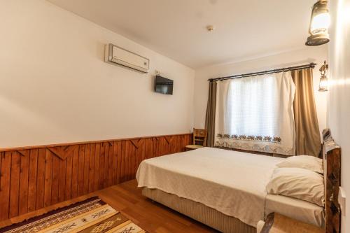 Voodi või voodid majutusasutuse Amazon Petite Palace toas
