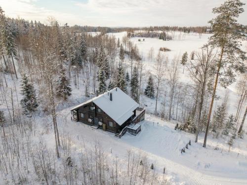 an aerial view of a cabin in the snow at Villa Breikki Himos - Alpha & Bravo Incl WiFi, Sauna, Jacuzzi for extra fee in Jämsä