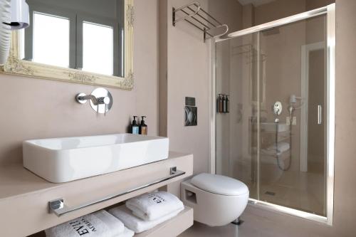 a bathroom with a sink and a toilet and a shower at EV 11 Athens in Athens