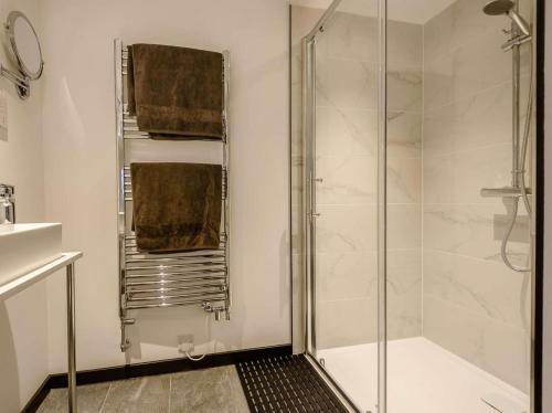 a bathroom with a shower and a glass shower stall at 1 Bed in Stoke-on-trent oc-89733 in Waterhouses
