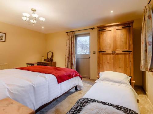 a bedroom with two beds and a window at 1 Bed in Stoke-on-trent oc-89733 in Waterhouses