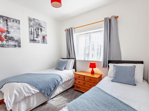 a bedroom with two beds and a window at 2 Bed in Bristol oc-37147 in Chew Magna
