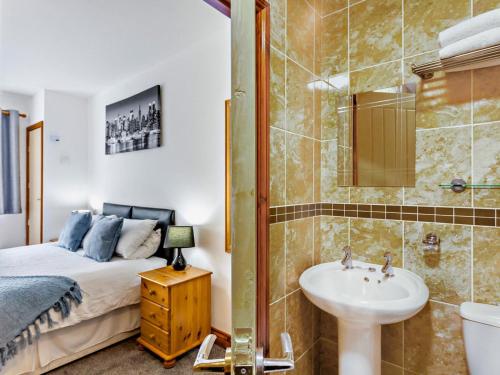a bedroom with a bed and a sink and a shower at 2 Bed in Bristol oc-37147 in Chew Magna