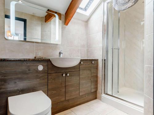 a bathroom with a sink and a shower at 1 Bed in Brecon oc-bn034 in Cray
