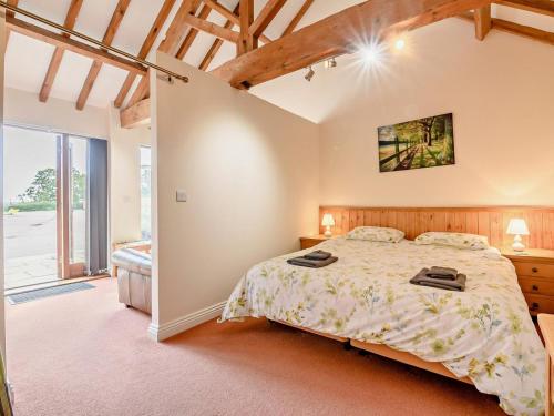 a bedroom with a large bed in a room at 1 Bed in Doncaster oc-93151 in Mattersey