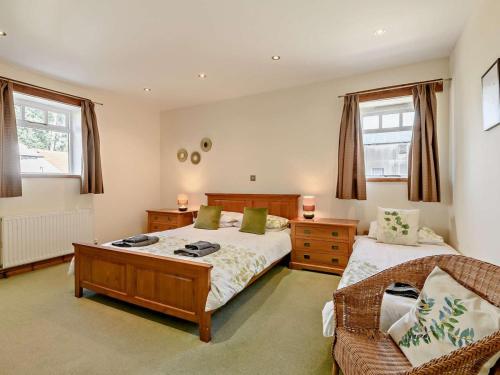 a bedroom with two beds and a couch at 2 Bed in Doncaster oc-93150 in Mattersey