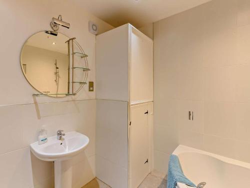 a white bathroom with a sink and a mirror at 2 Bed in Doncaster oc-93150 in Mattersey