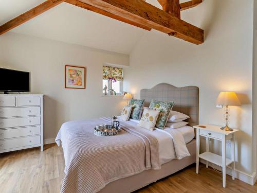 a bedroom with a large bed and a television at 1 Bed in Derby oc-76518 in Tutbury