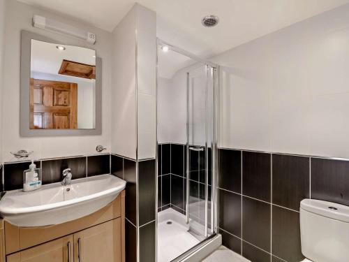 a bathroom with a sink and a shower at 1 Bed in Doncaster oc-91308 in Mattersey
