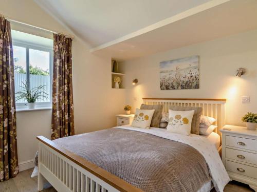 a bedroom with a large bed and a window at 2 Bed in Derby oc-76519 in Tutbury