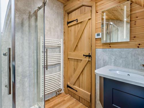 a bathroom with a shower and a sink at 2 Bed in Rhayader oc-90276 in Saint Harmon