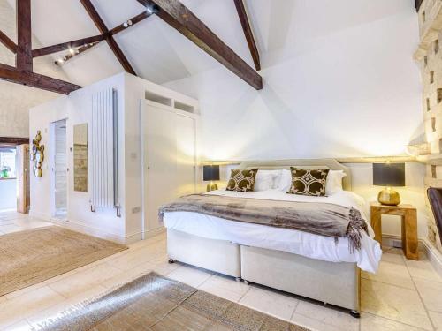 a bedroom with a large bed in a room at 3 Bed in Chippenham oc-77334 in Chippenham