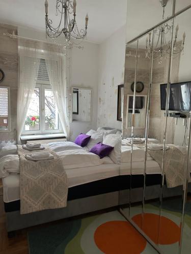 a bedroom with a large bed and a window at Lux Beba Pancevo in Pančevo