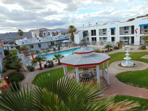 a view of a resort with a swimming pool at Ramada by Wyndham Kingman in Kingman