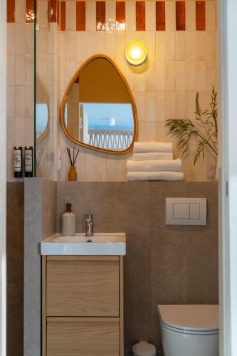 a bathroom with a sink and a mirror at Złota 34 Karwia in Karwia
