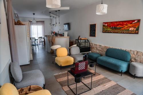 a living room with couches and chairs at Villa Aries - Rural Chic Experience in Gela