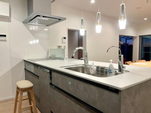a kitchen with a sink and a counter at Villa Okubo Akiya in Yokosuka