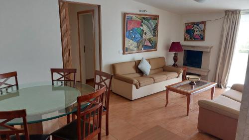 a living room with a glass table and a couch at Spacious 4-Bedroom Chalet - Ski and Summer in Kfardebian