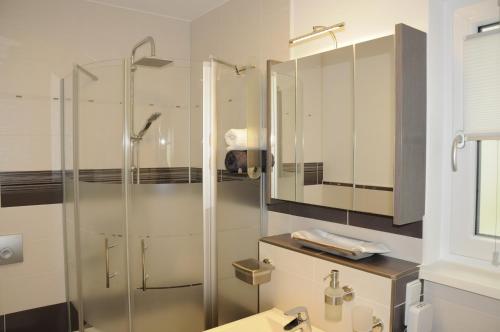 a bathroom with a shower and a sink at Pension Dietrich in Dobel