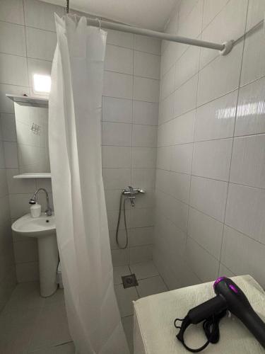 a bathroom with a shower and a sink at Main Square APT with Stone Bridge & Old Bazaar View in Skopje
